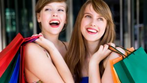 Two women with shopping bags